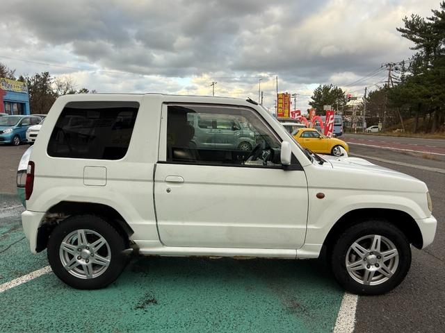 パジェロミニ 切り替え４ＷＤ　アクティブフィールドエディション　ＨＤＤナビ、ＣＤ／ＤＶＤ、ＥＴＣ、電動格納ミラー、キーレスエントリー、アルミホイール付き、（11枚目）