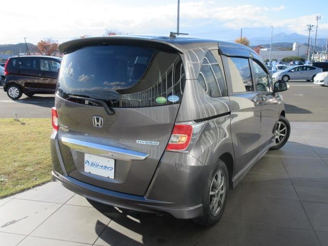 フリードハイブリッド ジャストセレクション 純正ナビ/フルセグTV/バックカメラ/ドライブレコーダー/ETC/スマートキー/HIDヘッドライト/オートライト/両側電動スライドドア/社外アルミホイール/電動格納ミラー(9枚目)