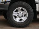 Ｔ１００ ＳＲ５　エクストラキャブ　買取直販　純正ホワイト　ロール式トノカバー　ＦＡＬＫＥＮワイルドピークＡＴ　トヨタ純正１６インチＡＷ　ベンチシート６人乗り　ＬＥＣＡＲＲＡステアリング　カロッツェリア７インチナビ　バックカメラ　サンル（8枚目）