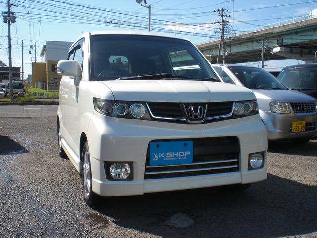 ゼストスパーク Ｗ　車検２年　４ＷＤ　ＡＢＳ　ＨＩＤ　電動格納ミラー　オートエアコン　バックカメラ　ワンセグＴＶ　ＣＤ　ＡＵＸ　スマートキー　社外アルミホイール　内外装クリーニング済（3枚目）