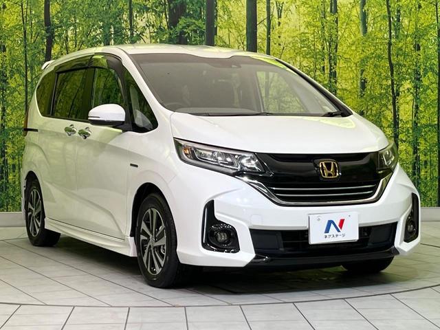 フリードハイブリッド ハイブリッド・Gホンダセンシング 両側電動ドア ナビ バックカメラ 衝突軽減装置 アダプティブクルーズ 半革シート スマートキー LEDヘッド ETC 車線逸脱警報 誤発進抑制機能 オートライト オートエアコン 純正15インチAW(17枚目)