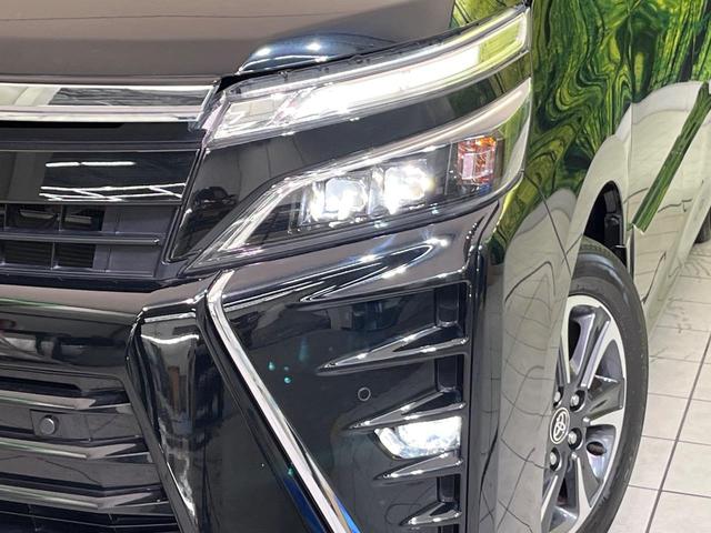 ヴォクシー ZS 煌II 後席モニター 純正9型ナビ 両側電動ドア 衝突軽減 バックカメラ クルコン コーナーセンサー LEDヘッド ETC リアオートエアコン オートハイビーム 車線逸脱警報 オートライト 純正16インチAW(13枚目)