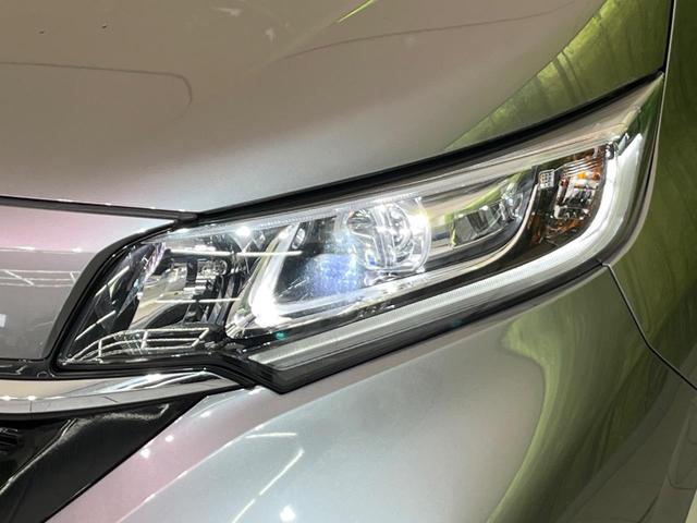 フリードハイブリッド ハイブリッド・Gホンダセンシング 両側電動ドア 純正9型ナビ バックカメラ アダプティブクルーズ スマートキー ハーフレザーシート ETC 車線逸脱警報 オートライト オートエアコン 純正15インチAW 革巻きステアリング(13枚目)