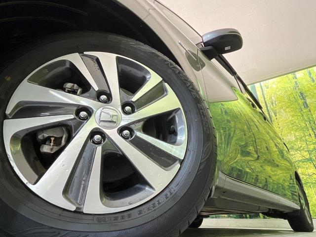 フリードハイブリッド ハイブリッド・Gホンダセンシング 両側電動ドア 純正9型ナビ バックカメラ アダプティブクルーズ スマートキー ハーフレザーシート ETC 車線逸脱警報 オートライト オートエアコン 純正15インチAW 革巻きステアリング(14枚目)