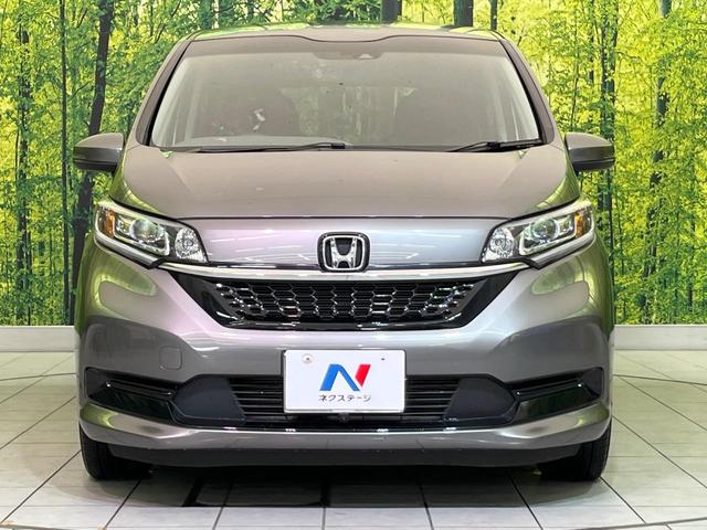 フリードハイブリッド ハイブリッド・Gホンダセンシング 両側電動ドア 純正9型ナビ バックカメラ アダプティブクルーズ スマートキー ハーフレザーシート ETC 車線逸脱警報 オートライト オートエアコン 純正15インチAW 革巻きステアリング(15枚目)