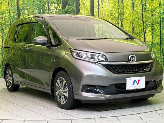フリードハイブリッド ハイブリッド・Gホンダセンシング 両側電動ドア 純正9型ナビ バックカメラ アダプティブクルーズ スマートキー ハーフレザーシート ETC 車線逸脱警報 オートライト オートエアコン 純正15インチAW 革巻きステアリング(17枚目)
