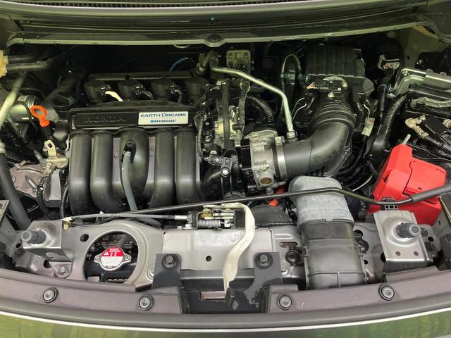 フリードハイブリッド ハイブリッド・Gホンダセンシング 両側電動ドア 純正9型ナビ バックカメラ アダプティブクルーズ スマートキー ハーフレザーシート ETC 車線逸脱警報 オートライト オートエアコン 純正15インチAW 革巻きステアリング(19枚目)