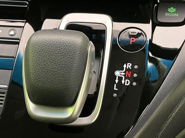 フリードハイブリッド ハイブリッド・Gホンダセンシング 両側電動ドア 純正9型ナビ バックカメラ アダプティブクルーズ スマートキー ハーフレザーシート ETC 車線逸脱警報 オートライト オートエアコン 純正15インチAW 革巻きステアリング(26枚目)