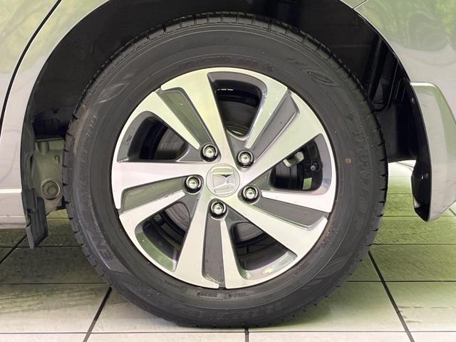 フリードハイブリッド ハイブリッド・Gホンダセンシング 両側電動ドア 純正9型ナビ バックカメラ アダプティブクルーズ スマートキー ハーフレザーシート ETC 車線逸脱警報 オートライト オートエアコン 純正15インチAW 革巻きステアリング(52枚目)