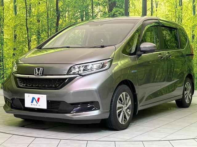 フリードハイブリッド ハイブリッド・Gホンダセンシング 両側電動ドア 純正9型ナビ バックカメラ アダプティブクルーズ スマートキー ハーフレザーシート ETC 車線逸脱警報 オートライト オートエアコン 純正15インチAW 革巻きステアリング(54枚目)