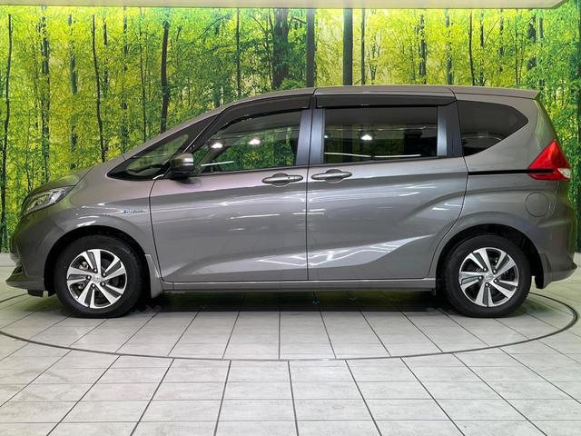 フリードハイブリッド ハイブリッド・Gホンダセンシング 両側電動ドア 純正9型ナビ バックカメラ アダプティブクルーズ スマートキー ハーフレザーシート ETC 車線逸脱警報 オートライト オートエアコン 純正15インチAW 革巻きステアリング(55枚目)