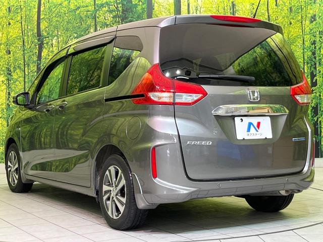 フリードハイブリッド ハイブリッド・Gホンダセンシング 両側電動ドア 純正9型ナビ バックカメラ アダプティブクルーズ スマートキー ハーフレザーシート ETC 車線逸脱警報 オートライト オートエアコン 純正15インチAW 革巻きステアリング(56枚目)