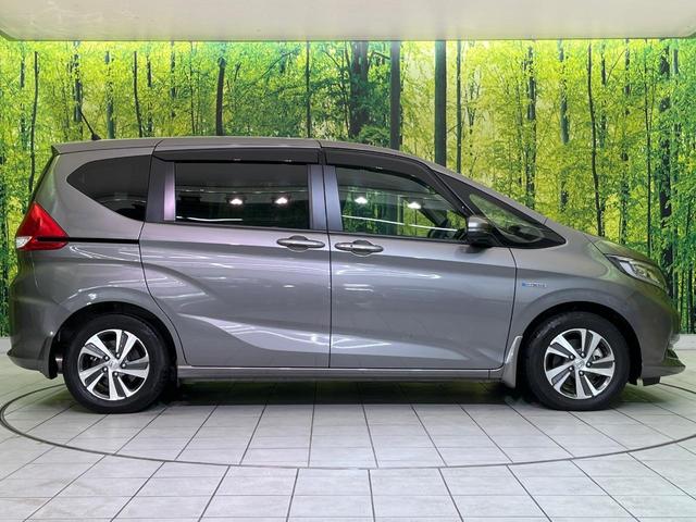フリードハイブリッド ハイブリッド・Gホンダセンシング 両側電動ドア 純正9型ナビ バックカメラ アダプティブクルーズ スマートキー ハーフレザーシート ETC 車線逸脱警報 オートライト オートエアコン 純正15インチAW 革巻きステアリング(57枚目)