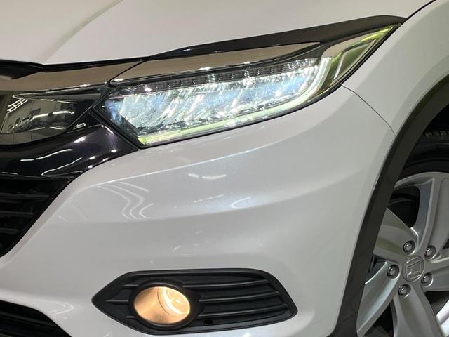ヴェゼル ハイブリッドＸ・ホンダセンシング　後期　純正８型ナビ　レーダークルーズ　バックカメラ　ＬＥＤヘッド　ＥＴＣ　誤発進抑制　車線逸脱警報　純正１７インチＡＷ　オートライト　オートエアコン　Ｂｌｕｅｔｏｏｔｈ　フルセグＴＶ　ＣＤ／ＤＶＤ再生（12枚目）