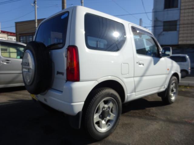 ジムニー ＸＧ　４ＷＤ　オートマ　ナビＴＶ　キーレスエントリー　アルミホイール　背面タイヤ　エアコン　パワステ　パワーウィンドウ　運転席助手席エアバック（4枚目）