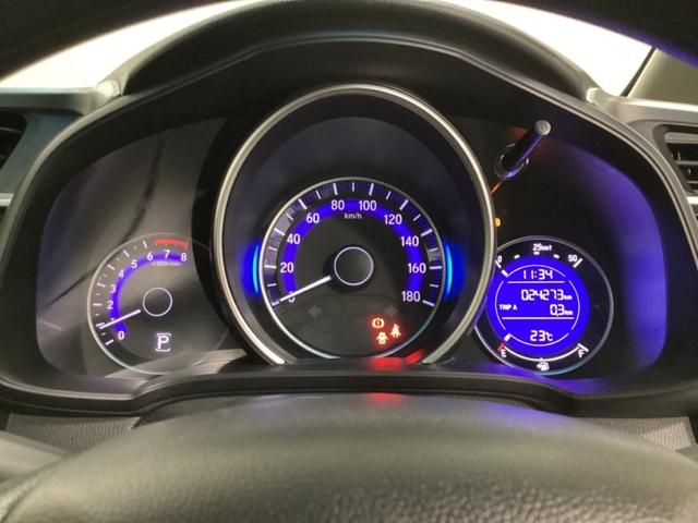 フィット １３Ｇ・Ｆパッケージ　光触媒抗菌消臭施工済　イモビ　ＤＶＤ再生可能　スマ－トキ－　ＶＳＡ　地デジＴＶ　助手席エアバッグ　Ｒカメラ　オートエアコン　エアバック　ＰＳ　キ－フリ－　ＰＷ　ＡＢＳ　ＴＶナビ　アイドリングＳＴＯＰ（10枚目）