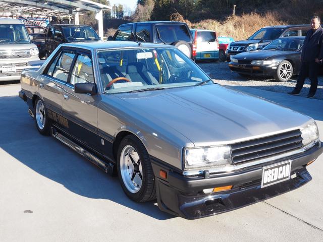 スカイライン 　車検整備付き　５ＭＴ　Ｆ・Ｓ・Ｒエアロ　社外ウッドハンドル　４点式ロールバー　ＨＯＳＨＩＮＯＲＡＣＩＮＧホイール　ローダウン　社外マフラー　Ｒウィング（ゲタ羽）（2枚目）