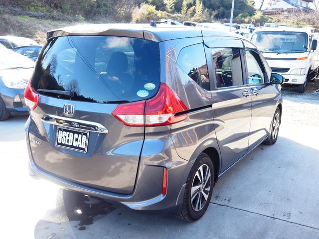 フリード G・ホンダセンシング 車検令和9年11月 1年保証 ナビ バックカメラ 後席モニター 衝突軽減ブレーキ ホンダセンシング プッシュスタート 両側パワスラ ハーフレザーシート ETC LEDヘッドライト(5枚目)