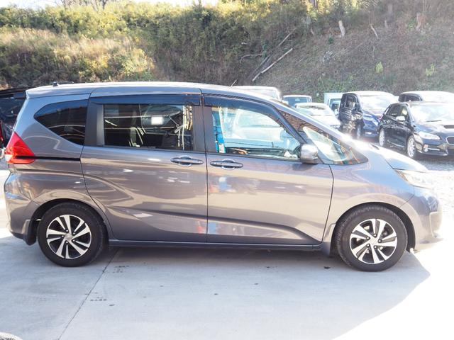 フリード G・ホンダセンシング 車検令和9年11月 1年保証 ナビ バックカメラ 後席モニター 衝突軽減ブレーキ ホンダセンシング プッシュスタート 両側パワスラ ハーフレザーシート ETC LEDヘッドライト(7枚目)