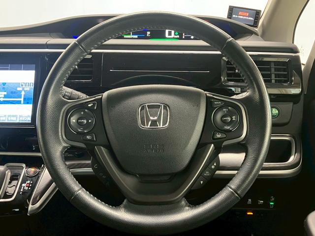 ステップワゴンスパーダ スパーダハイブリッド　Ｇ・ＥＸ　ホンダセンシング　純正９インチナビ　１０インチフリップダウンモニター　全周囲カメラ　ＡＣＣ　ＬＥＤライト　両側電動ドア　衝突軽減ブレーキ　ドラレコ　後席エアコン　ＥＴＣ　横滑り防止　シートヒーター　ハーフレザーシート（9枚目）