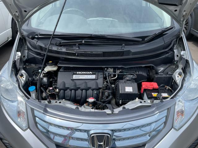 フリードハイブリッド ジャストセレクション　社外ナビ　ＴＶ　ＤＶＤ　エンスタ　ＥＴＣ　スマートキー　片側パワースライドドア　ＨＩＤライト　７人乗　横滑り防止装置　内外装クリーニング済（50枚目）