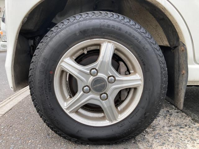 ハイゼットカーゴ デッキバンＧ　４ＷＤ　５速マニュアル　両側スライドドア　前方ドラレコ　ポータブルナビ　荷台マッド　社外アルミ　ＣＤデッキ　シートカバー　車検Ｒ９年１月　パワステ　エアコン　パワーウィンドウ　１７３７１５ｋｍ　軽バン（65枚目）