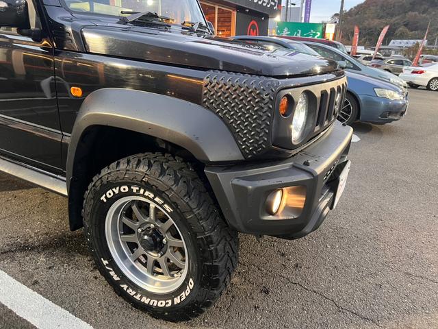 ジムニーシエラ ＪＣ　ワンオーナー　２インチリフトアップ　マッドテレインタイヤ　レイズ１５インチＡＷ　セーフティサポート　クルーズＣ　ダウンヒルアシスト　純正ナビフルセグＢカメラ　シートカバー（34枚目）