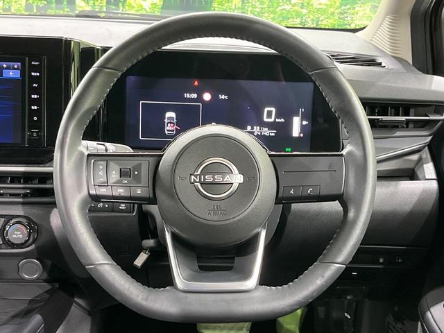 ノート Ｘ　ＦＯＵＲ　純正９インチナビ　バックカメラ　禁煙車　衝突軽減装置　スマートキー　オートライト　ＥＴＣ　シートヒーター　ドラレコ　レーンアシスト　クリアランスソナー　ドアバイザー　電動格納ミラー　プライバシーガラス（12枚目）