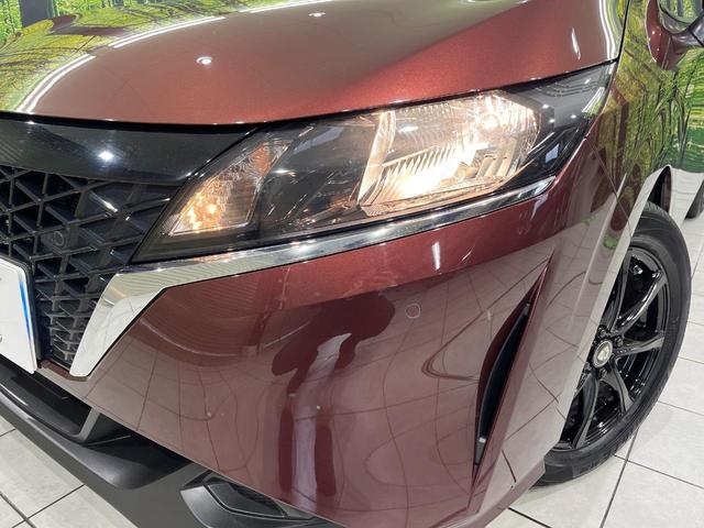 ノート Ｘ　ＦＯＵＲ　純正９インチナビ　バックカメラ　禁煙車　衝突軽減装置　スマートキー　オートライト　ＥＴＣ　シートヒーター　ドラレコ　レーンアシスト　クリアランスソナー　ドアバイザー　電動格納ミラー　プライバシーガラス（13枚目）