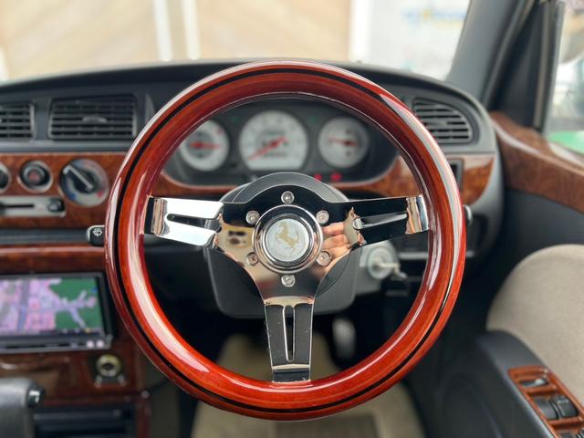 ミラジーノ ジーノ　社外ステアリング　パワステ　キーレス付き　衝突安全ボディ　マニュアルエアコン　全席パワーウインドウ　ＳＲＳ　カロッツェリアナビ（10枚目）