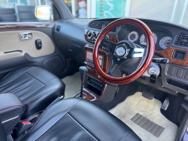 ミラジーノ ジーノ　社外ステアリング　パワステ　キーレス付き　衝突安全ボディ　マニュアルエアコン　全席パワーウインドウ　ＳＲＳ　カロッツェリアナビ（11枚目）