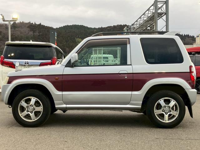 パジェロミニ ナビエディションXR オーディオ/純正アルミホイール/電動格納ミラー/トランクスポイラー/ルーフレール/パワーウィンドウ/ハロゲンライト/エアバッグ/キーレス/マニュアルエアコン(5枚目)