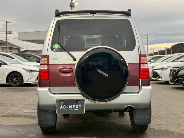 パジェロミニ ナビエディションXR オーディオ/純正アルミホイール/電動格納ミラー/トランクスポイラー/ルーフレール/パワーウィンドウ/ハロゲンライト/エアバッグ/キーレス/マニュアルエアコン(6枚目)