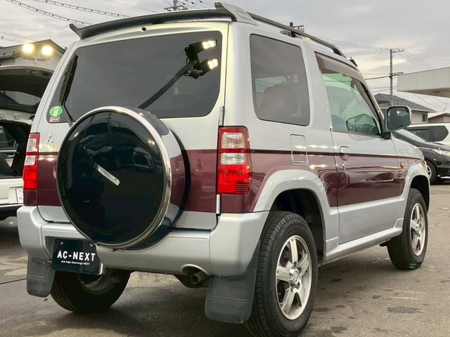 パジェロミニ ナビエディションXR オーディオ/純正アルミホイール/電動格納ミラー/トランクスポイラー/ルーフレール/パワーウィンドウ/ハロゲンライト/エアバッグ/キーレス/マニュアルエアコン(17枚目)