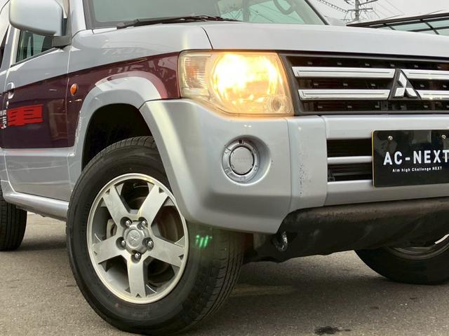 パジェロミニ ナビエディションXR オーディオ/純正アルミホイール/電動格納ミラー/トランクスポイラー/ルーフレール/パワーウィンドウ/ハロゲンライト/エアバッグ/キーレス/マニュアルエアコン(27枚目)