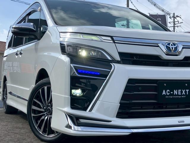 ヴォクシー ハイブリッドＺＳ　煌ＩＩＩ　純正ディスプレイナビ　バックカメラ　フルセグ　モデリスタフルエアロ　クルコン　Ｗエアコン　シートヒーター　ＥＴＣ　電動格納ミラー　オートライト　ステリモ　衝突軽減　レーンキープ　横滑り防止　エアバッグ（34枚目）