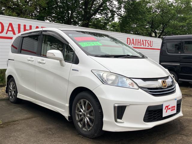 フリードハイブリッド ジャストセレクション　ＥＴＣ　バックカメラ　ナビ　ＴＶ　オートクルーズコントロール　両側電動スライドドア　ＨＩＤ　スマートキー　電動格納ミラー　３列シート　ウォークスルー　ＣＶＴ　アルミホイール　盗難防止システム（13枚目）