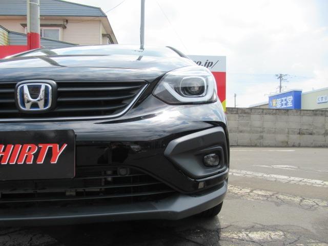 フィット ｅ：ＨＥＶクロスター　４ＷＤ／禁煙車／寒冷地仕様／衝突軽減ブレーキ／クリアランスソナー／レーダークルコン／純正ナビ／フルセグ／前後ドライブレコーダー／純正アルミホイール／ドアバイザー／バックカメラ／ＥＴＣ／ワイパーデアイサ（75枚目）