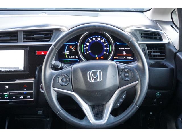 フィットハイブリッド Ｌパッケージ　４ＷＤ　ナビ　フルセグＴＶ　バックモニター　プッツシュスタート　クルーズコントロール　オートライト　ＥＴＣ　電動格納ミラー　ＬＥＤヘッドライト　２年保証付（5枚目）