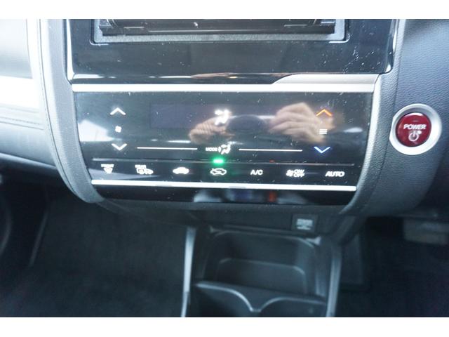 フィットハイブリッド Ｌパッケージ　４ＷＤ　ナビ　フルセグＴＶ　バックモニター　プッツシュスタート　クルーズコントロール　オートライト　ＥＴＣ　電動格納ミラー　ＬＥＤヘッドライト　２年保証付（9枚目）