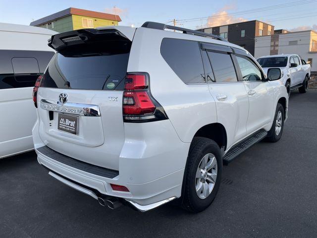 ランドクルーザープラド TX Lパッケージ ワンオーナー サンルーフ 黒革シート 純正ナビ 全方位カメラ モデリスタエアロ トヨタセーフティセンス レーダークルーズ 純正17インチアルミホイール 前席エアシート 2本出しマフラー BSM ETC(3枚目)
