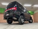 Ｇ　プレミアム　４ＷＤ　リフトアップ　純正ナビ　バックカメラ　ＭＫＷ１６インチアルミホイール　ジオランダー　オーバーフェンダー　ガナドール２本出しマフラー　前席シートヒーター　デジタルインナーミラー　両側電動スライド（66枚目）