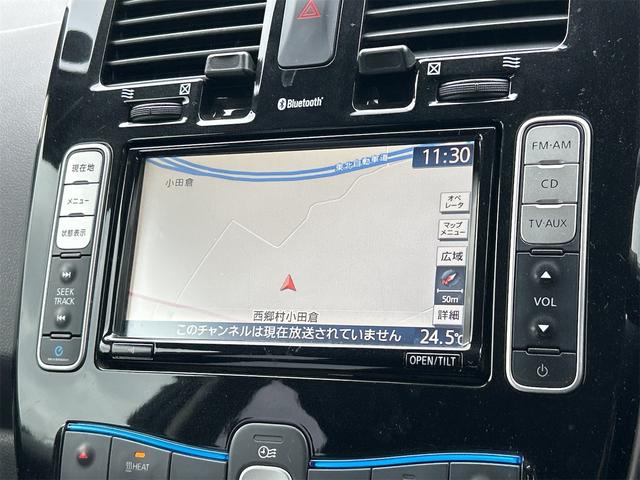 リーフ Ｘ　バックカメラ　ナビ　オートクルーズコントロール　スマートキー　電動格納ミラー　シートヒーター　ＣＶＴ　盗難防止システム　衝突安全ボディ　ＡＢＳ　ＥＳＣ　ＣＤ　ミュージックプレイヤー接続可　エアコン（3枚目）