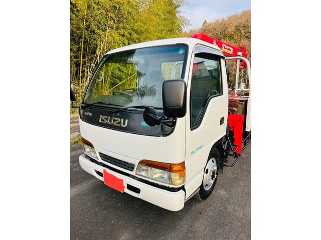 エルフトラック ロング 平ボディー ロングワイド 4WD 最大積載量2000kg ユニッククレーン ラジコン付き アウトリガー 5速マニュアル エンジン4HG1 エアコン パワステ パワーウィンドウ 坂道発進補助装置付き(2枚目)