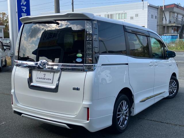 ヴォクシー ハイブリッドV 両側パワースライドドア/モデリスタエアロ/横滑防止/おくだけ充電/リアヒーター/ナビ/Bluetooth/DVD再生/バックカメラ/前席シートヒーター/ビルトインETC/オート電動格納サイドミラー(3枚目)