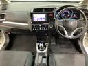 フィットハイブリッド Ｆパッケージ　純正メモリーナビ　フルセグＴＶ　Ｂｌｕｅｔｏｏｔｈ　バックカメラ　ＥＴＣ　純正エンジンスターター　社外アルミホイール　盗難防止システム　キーレスエントリー　スマートキー（5枚目）