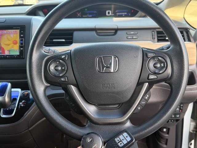フリードハイブリッド ハイブリッド・Ｇホンダセンシング　４ＷＤ　純正ナビ　フルセグＴＶ　Ｂｌｕｅｔｏｏｔｈ　バックカメラ　純正エンジンスターター　ＥＴＣ　両側パワースライドドア（3枚目）