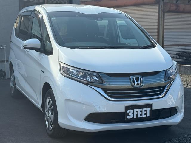 フリードハイブリッド ハイブリッド・Ｇホンダセンシング　４ＷＤ　純正ナビ　フルセグＴＶ　Ｂｌｕｅｔｏｏｔｈ　バックカメラ　純正エンジンスターター　ＥＴＣ　両側パワースライドドア（14枚目）
