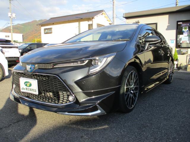 カローラツーリング ハイブリッド　ダブルバイビー　モデリスタエアロ　ＴＲＤ１８インチＡＷ　純正ディスプレイオーディオ　トヨタセーフティセンス　レーダークルーズコントロール　バックカメラ　ステアリングヒーター　ハーフレザーシート　シートヒーター（3枚目）