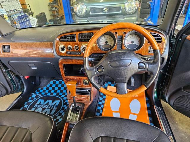 ミラジーノ ミニライトスペシャル　後期型　走行距離３１０００キロ　タイミングベルト＆ウォーターポンプ交換　純正レザー調黒シート　フォグ　Ｆリップ付　黒１４インチアルミ　国産タイヤ４本交換　ウッド調パネル　ウッドコンビハンドル　キーレス（11枚目）